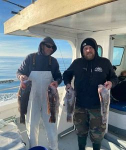 Two happy anglers with their catch.