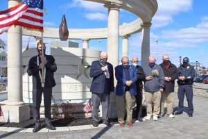 The people of Sea Isle City were asked to pause for a moment of silence at 11 a.m. March 29 in honor of National Vietnam War Veterans Day.  Shown standing quietly in Veterans Park next to the City’s Memorial Fountain are (from left) Vietnam War Veteran (U.S. ArmyVFW Post 1963 Color Guard member Joe McLenaghan; Vietnam War Veteran (U.S. Navy) / VFW Post 1963 Commander Charles Haines; Mayor Leonard Desiderio; City Council members Jack Gibson