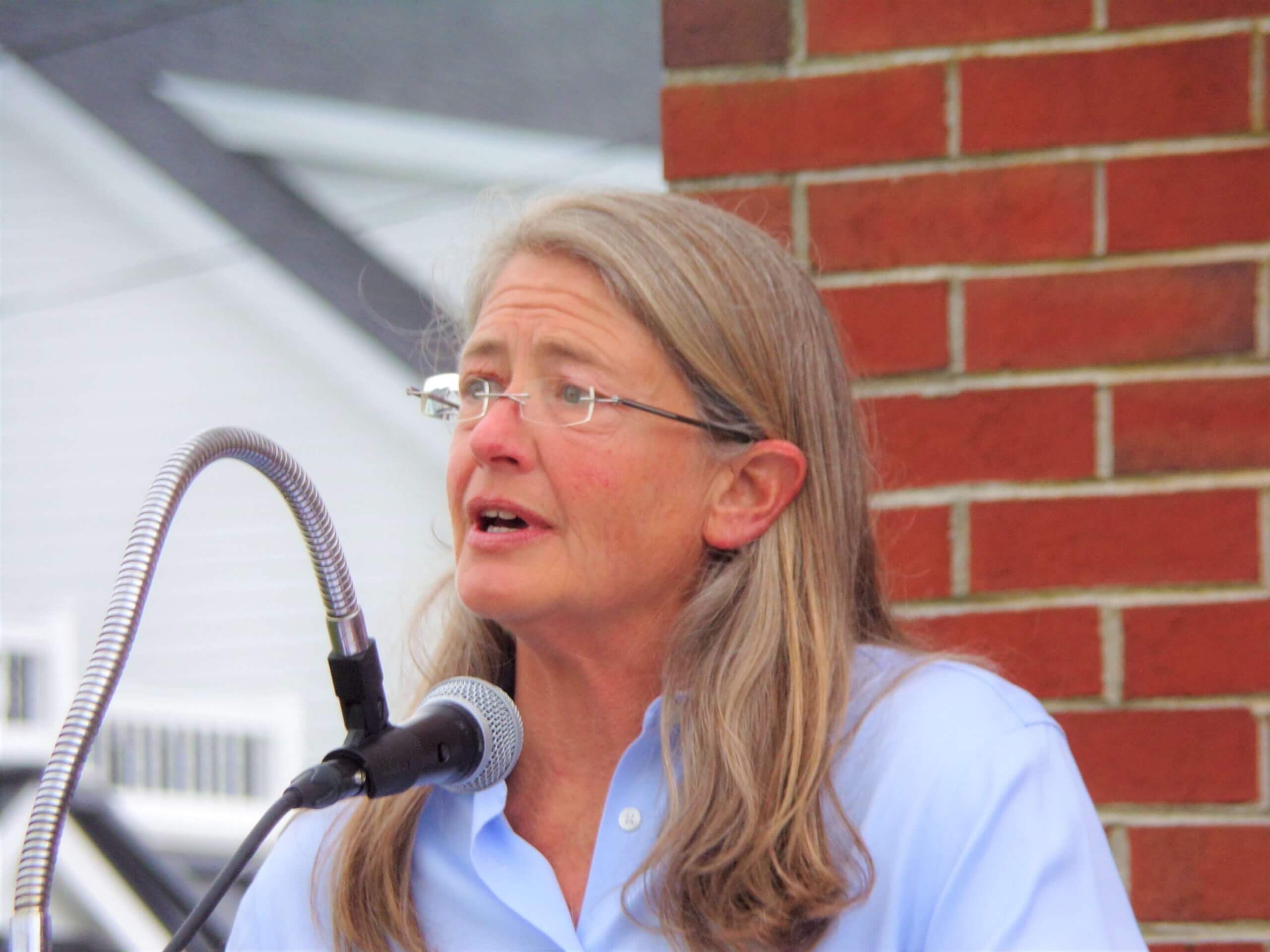 Pastor Kate Aaronson believes in the statue's mission despite criticism.  