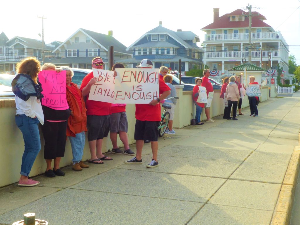 Protestors gathered outside Ocean City’s Flanders Hotel June 4 in opposition to a gala held at the hotel to honor School Superintendent Kathleen Taylor’s retirement. Taylor and the school district have come under scrutiny amid recent claims by students and alumni of harassment and abuse taking place in the city’s schools. 