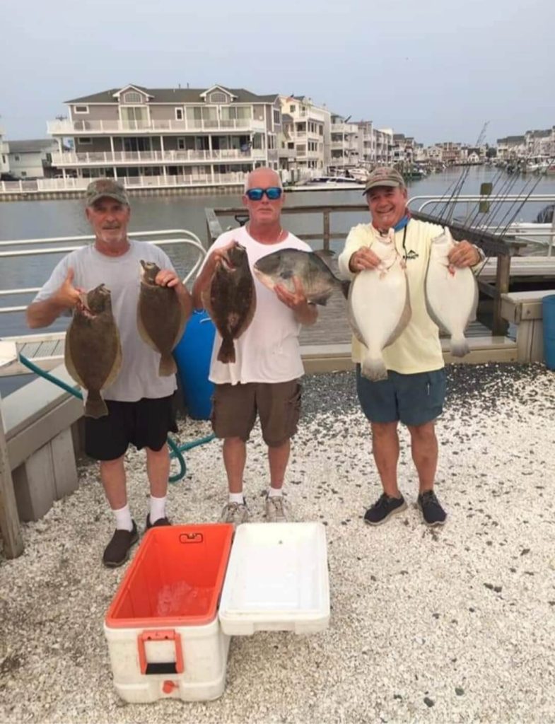 Happy anglers and their catches.
