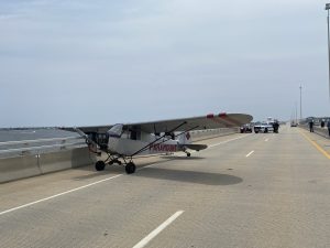 A pilot for Paramount Air Service landed a banner plane on the Route 52 Causeway