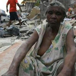 A woman sits amid the rubble after a 7.2 magnitude earthquake destroyed many buildings in the southwestern part of Haiti Aug. 14.  