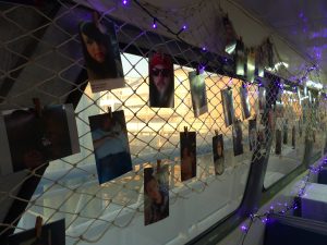 A photo gallery in the vessel’s lower deck features images of those remembered Aug. 25.
