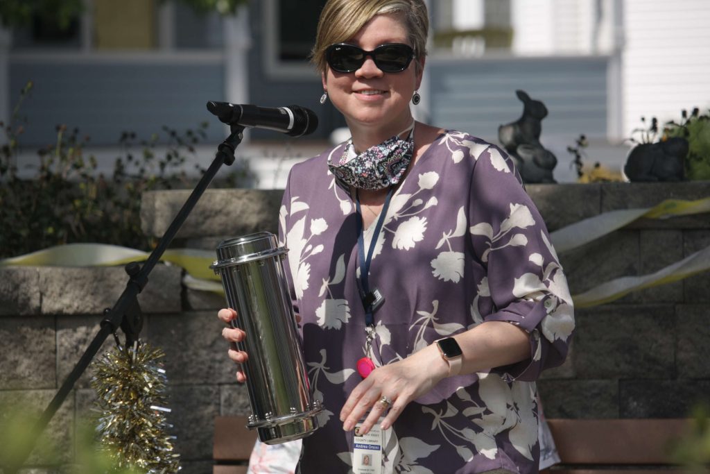 Library Director Andrea Orsini holds the time capsule to be buried during the Cape May County Library System’s 50th anniversary celebration Sept. 18