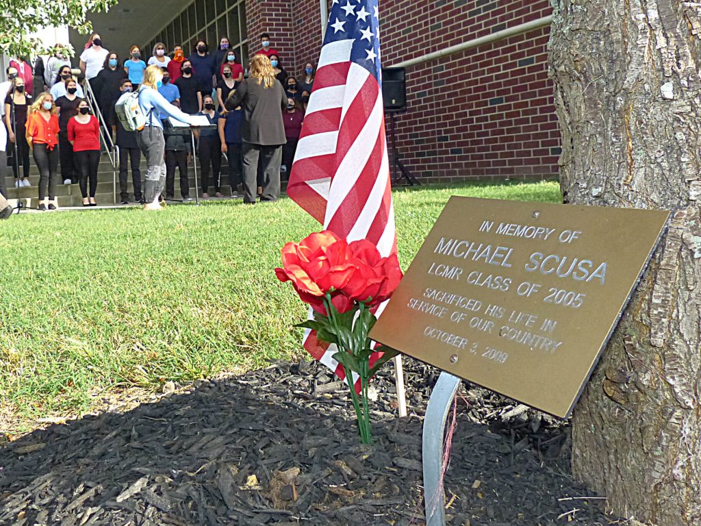 Sgt. Michael Scusa's memorial plaque at the base of the tree outside Lower Cape May Regional High School