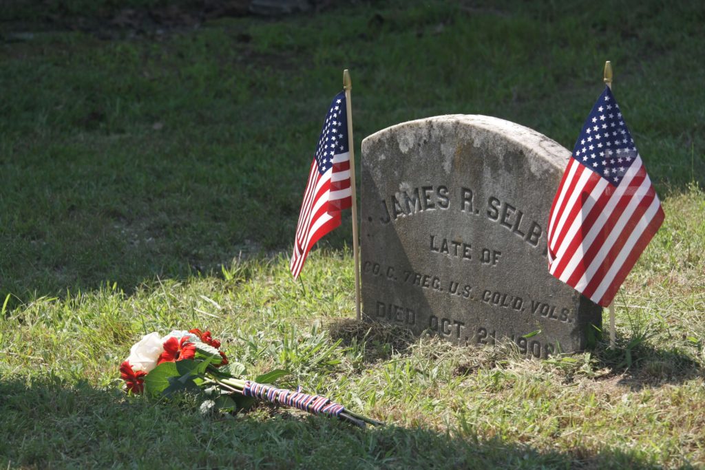 James Selby’s grave after the performance of taps and the laying of a flower bouquet to pay homage for his service