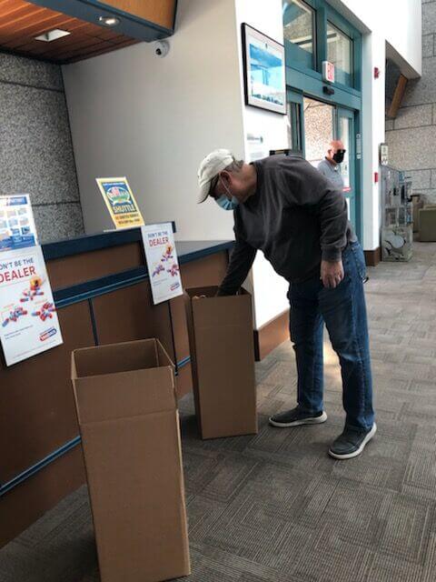 A Lewes Terminal visitor hands in prescription drugs in April 2021.