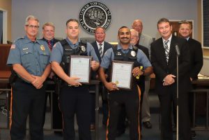 Lower Township Council Oct. 18 honors police officers Robert Fessler and Jordan Saini for saving the life of a drowning 2-year-old in Cold Spring.