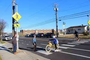 Ocean City Mayor Jay Gillian and Police Chief Jay Prettyman watch students using the new crosswalk at 20th Street and Bay Avenue.