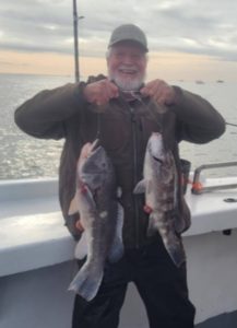 Jerry Rau and his 8- and 6-pound blackfish. 