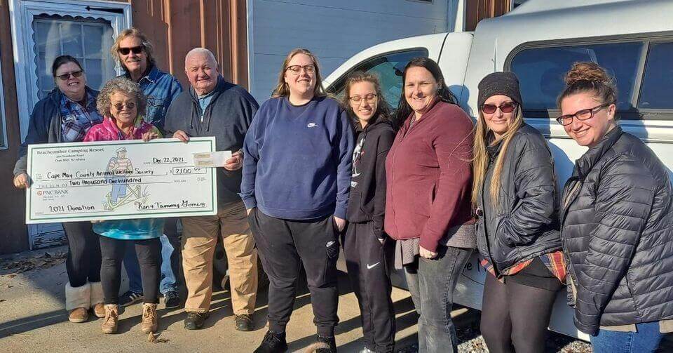 Anita Faircloth and Ray Webb of AWS accepting the check donation from Beachcomber Camping Resort