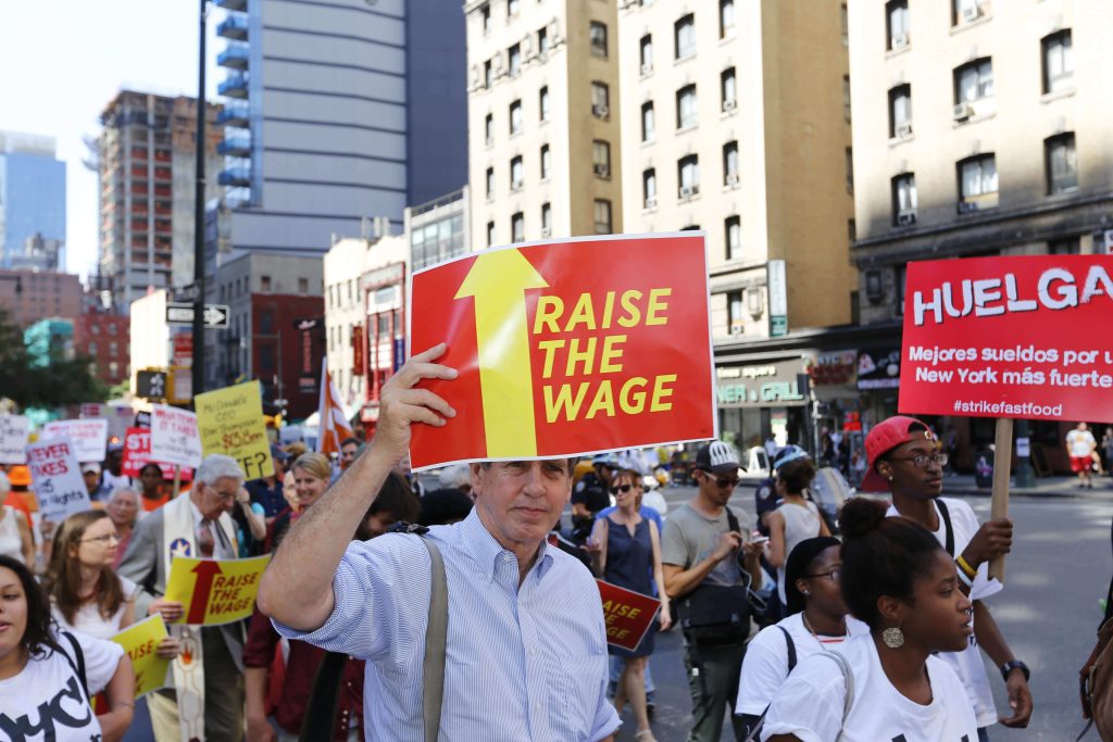 Workers protest in New York for a higher minimum wage.