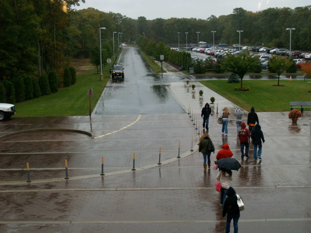 Students leaving class on a rainy day at Atlantic Cape Community College.