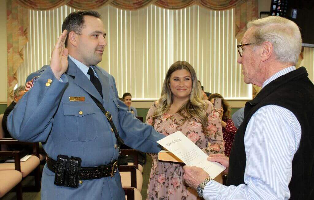 Mayor Martin Pagliughi swears in Sgt. Gregory Armstrong at a Borough Council meeting March 23.