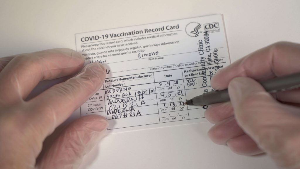 VACCINE CARD WITH BOOSTERS FILE PHOTO