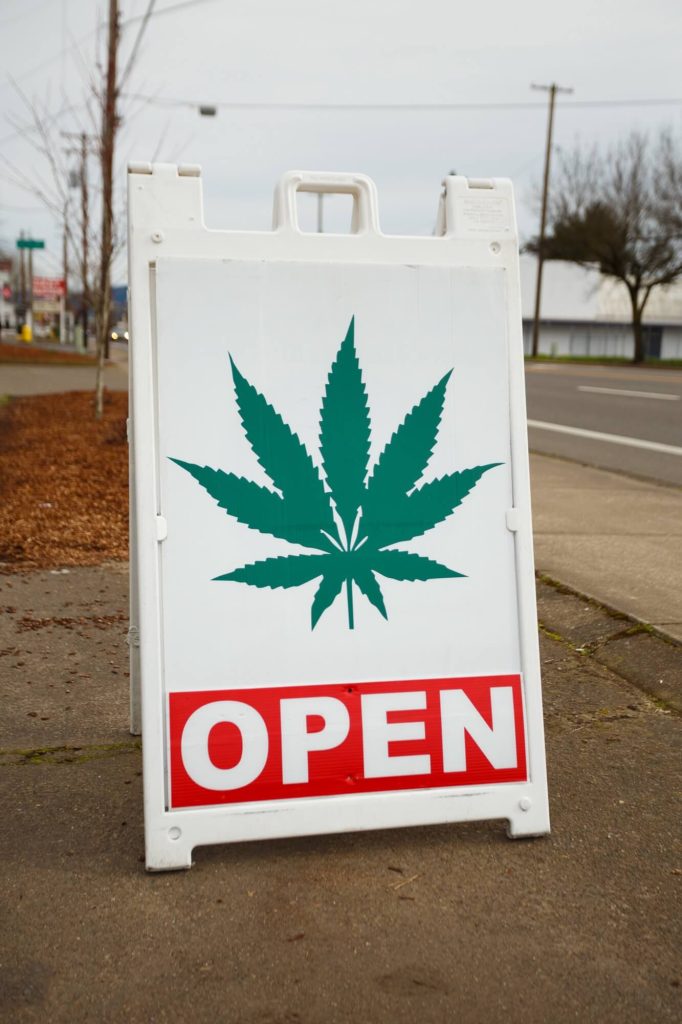 WEED MARIJUANA POT DISPENSARY OPEN SIGN FILE PHOTO