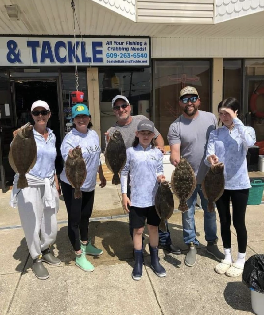 Happy anglers with their flounder. 