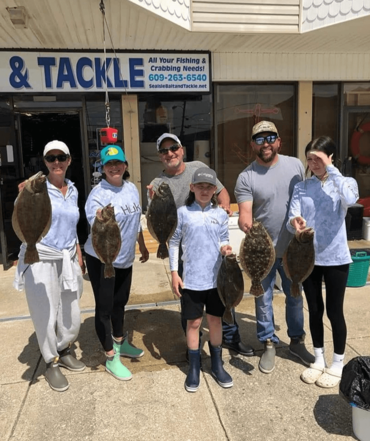 Happy anglers with their flounder. 
