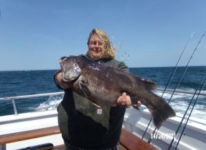 Chris Hackett and his 12-pound blackfish.