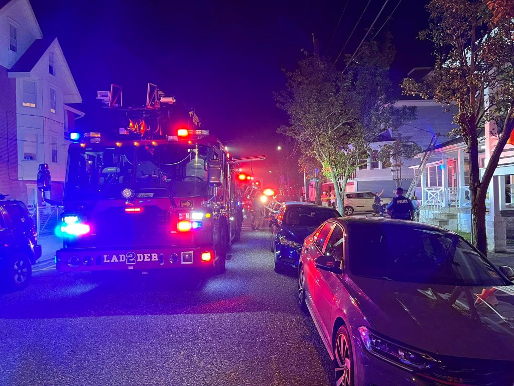 Ladder trucks arrive at the blaze on Maple Avenue.