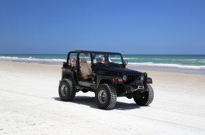 jeep vehicle car on beach stock