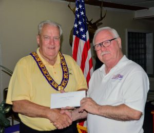 Dennis Lennon (right) presents the check to Ted Nulty (left). 