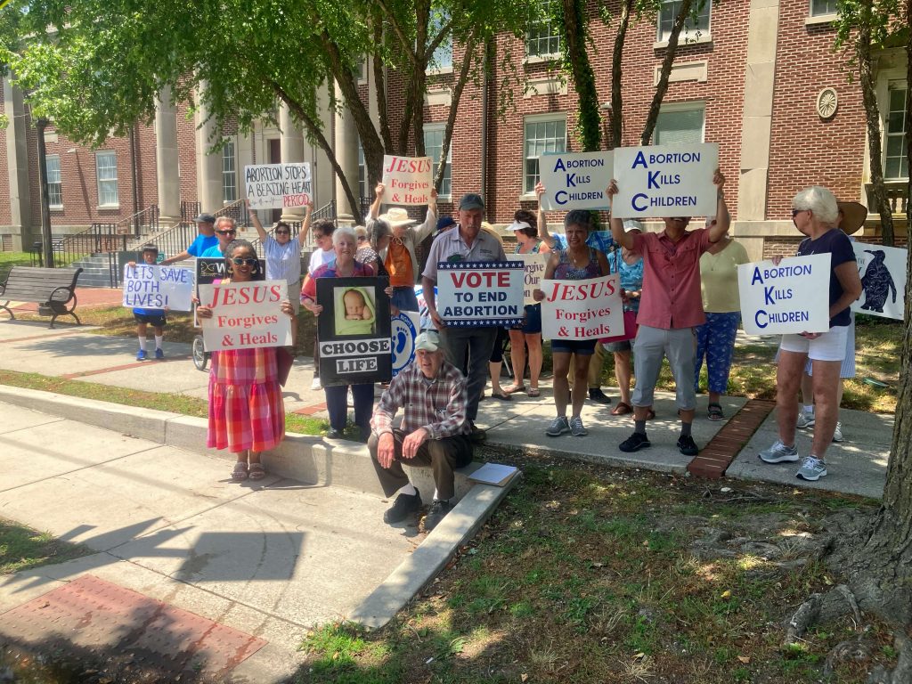 Participants gather for a prayer vigil in front of the Cape May County courthouse June 17.