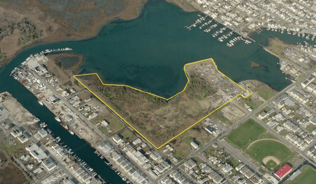 An aerial shot of Wildwood shows a yellow line around the back bay landfill. The City of Wildwood has contracted two firms to prepare the site for future development. 