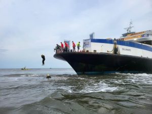 A participant is seen jumping off the Cape May-Lewes Ferry into the Delaware Bay for the annual Escape the Cape Triathlon