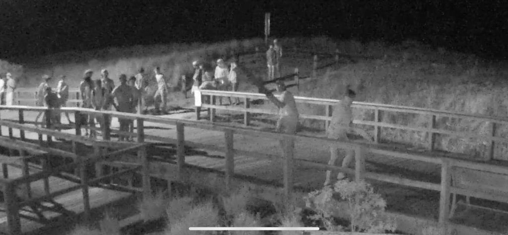 A surveillance camera captures a group of individuals gathered on the boardwalk outside the home of an Avalon resident