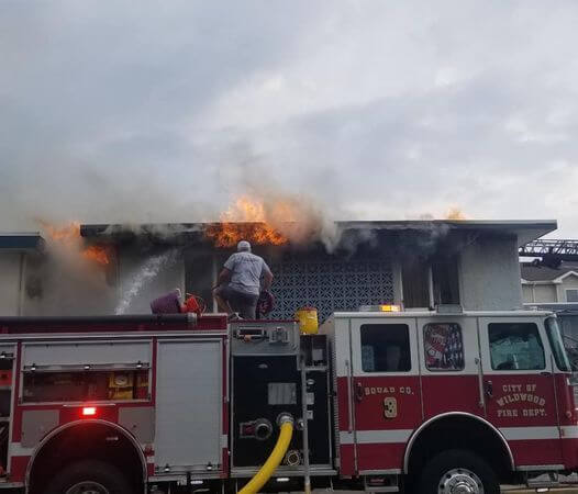 Firefighters arrive on scene to fight a blaze at the Windward Motel June 14