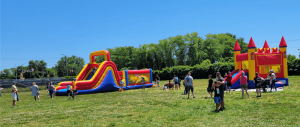 Children and parents have fun in the Bounce House amusements at the Sandman Consolidated School carnival June 4