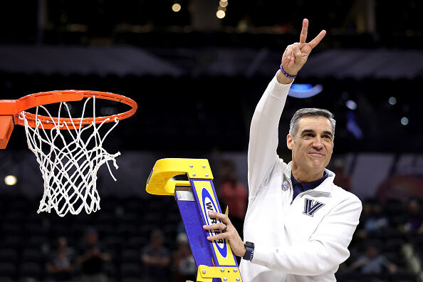 Head coach Jay Wright of the Villanova Wildcats cuts down the net after defeating the Houston Cougars 50-44 in the NCAA Men's Basketball Tournament Elite 8 Round at AT&T Center March 26