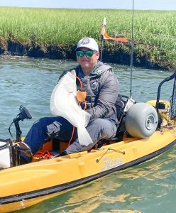 Jacob Cana and his first-place 6.8-pound flounder.