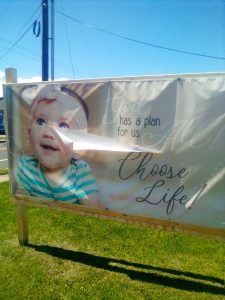 The slashed banner outside St. John Neumann's on May 27