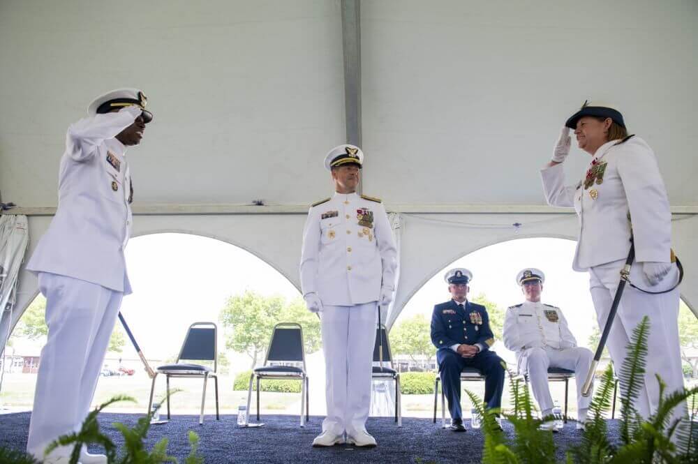 Capt. Warren Judge (left) relieved Capt. Kathy Felger (right) as commanding officer of U.S. Coast Guard Training Center Cape May