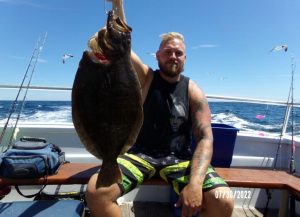 Chris Gardner and his 6.4-pound fluke. 