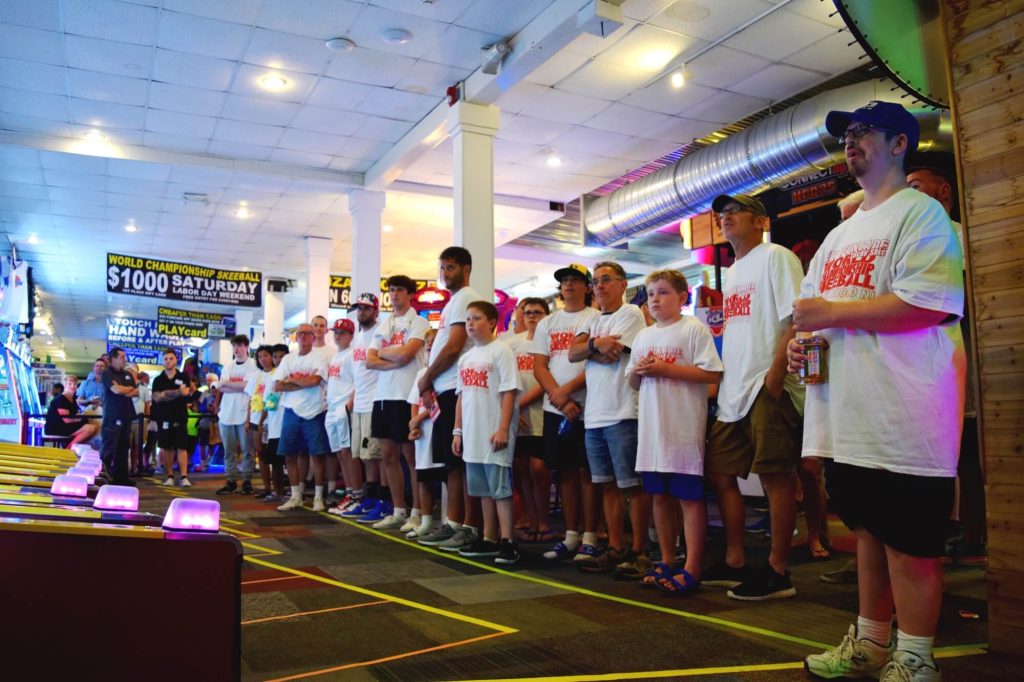 26 people qualified for this year’s Skee-Ball World Championship. Contestants are pictured throwing balls in an early round. 