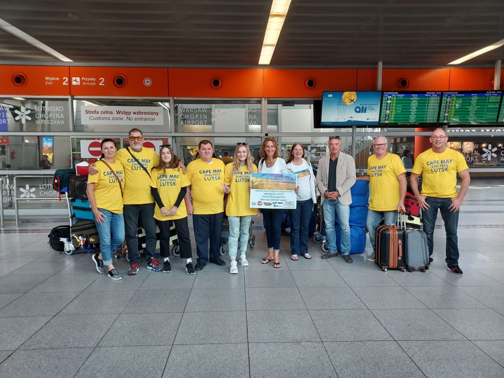 Volunteers gather at the airport in Poland for a picture ahead of their trip to the Ukraine border. A group of business owners in Cape May has organized to raise support for Ukrainians afflicted by war.