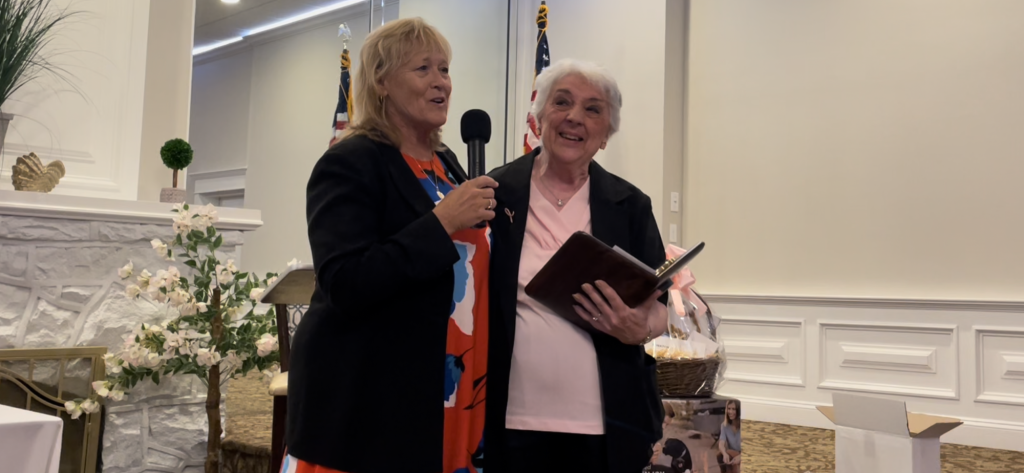 Cape May County Commissioner Marie Hayes presents Lower Township Chamber of Commerce Executive Director Linda Williams with an award in recognition of her community service and dedication at the Lower Township Chamber of Commerce 2022 Awards Dinner. 