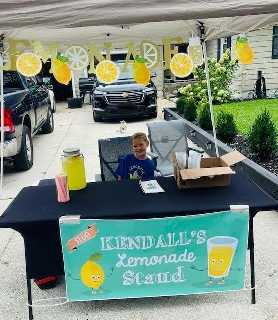 Kendall Thomas sells lemonade to raise money for local school children in Lower Township.