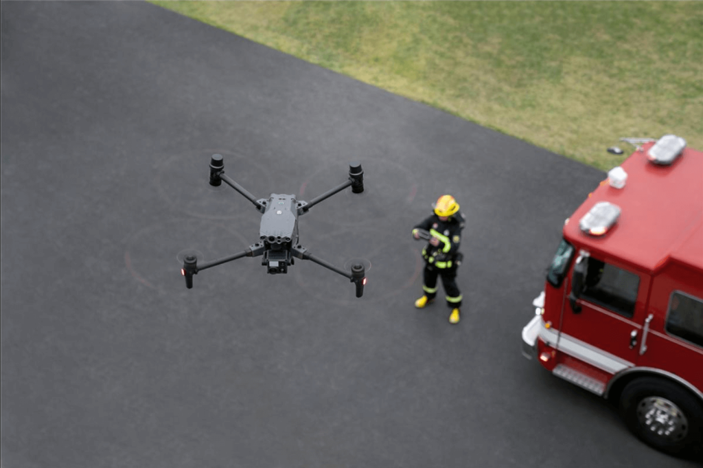 A firefighter uses the Matrice 30T