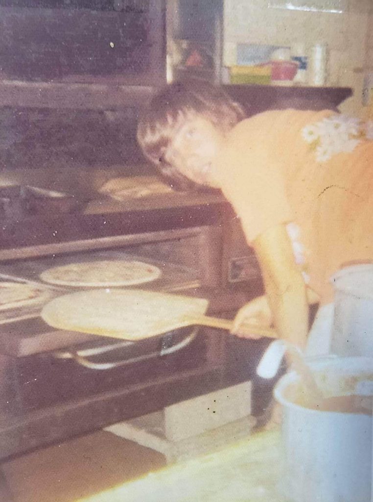 Drew Buchanan works the oven at Avalon Pizza in 1977. Buchanan will open MexItalia