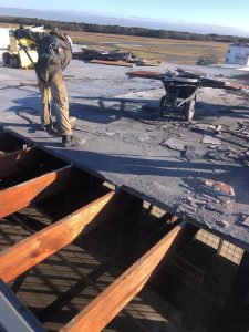 Demolition of existing roof.