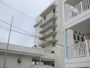 Workers were on the scene the day after a balcony collapsed on the balcony below