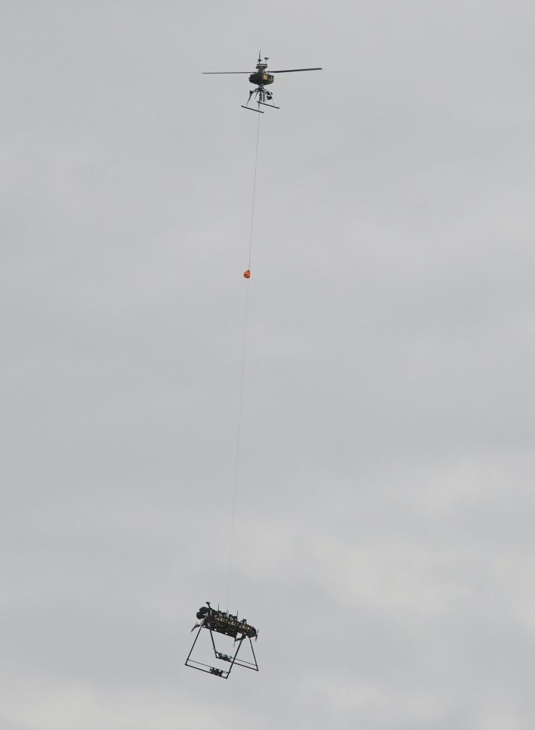 A drone and attached robot are used to install new bird diverters along Stone Harbor Boulevard in Cape May County