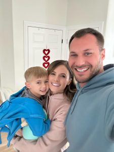 Hudson Biederman is shown with his parents