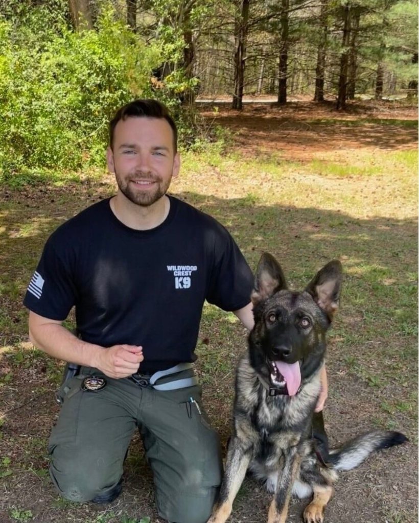 Officer Tyler Lavender is shown with his K-9 partner