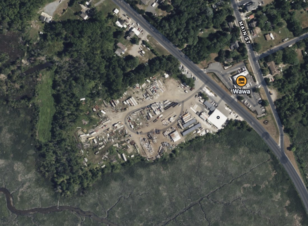 The front portion of the existing junkyard will likely soon be replaced by a Wawa with a gas station. Most of the junkyard away from the road will remain. Across Route 47